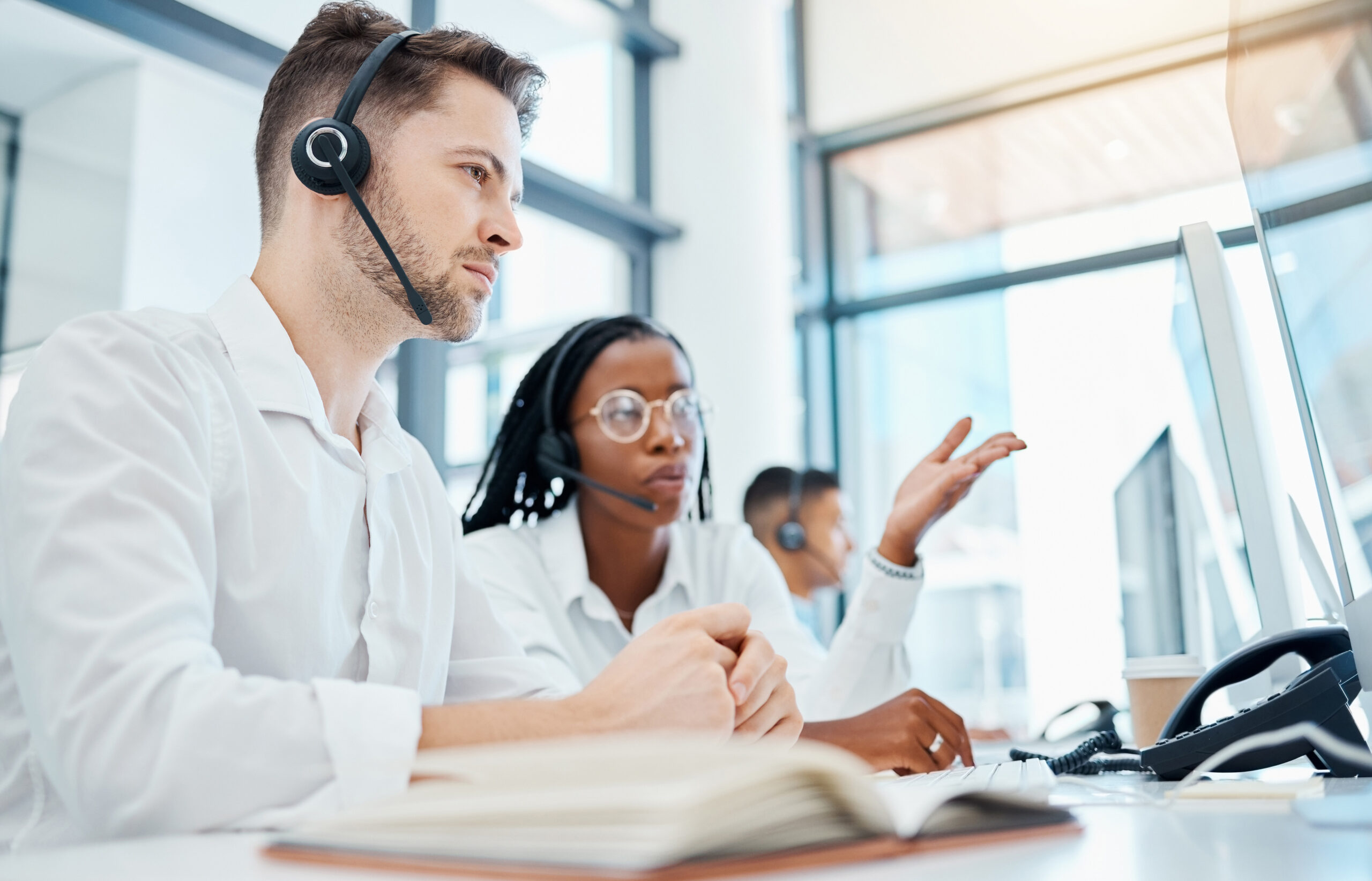 Call center, customer service and leader training employee on telemarketing strategy on contact us computer in office. Coaching, talking or collaboration teamwork thinking and planning of crm support.